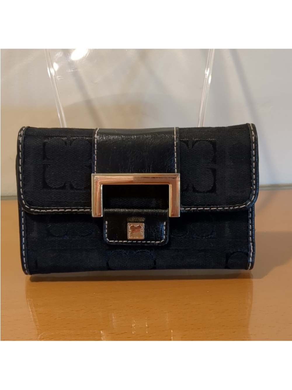 Black Liz Claiborne wallet with gold accents.